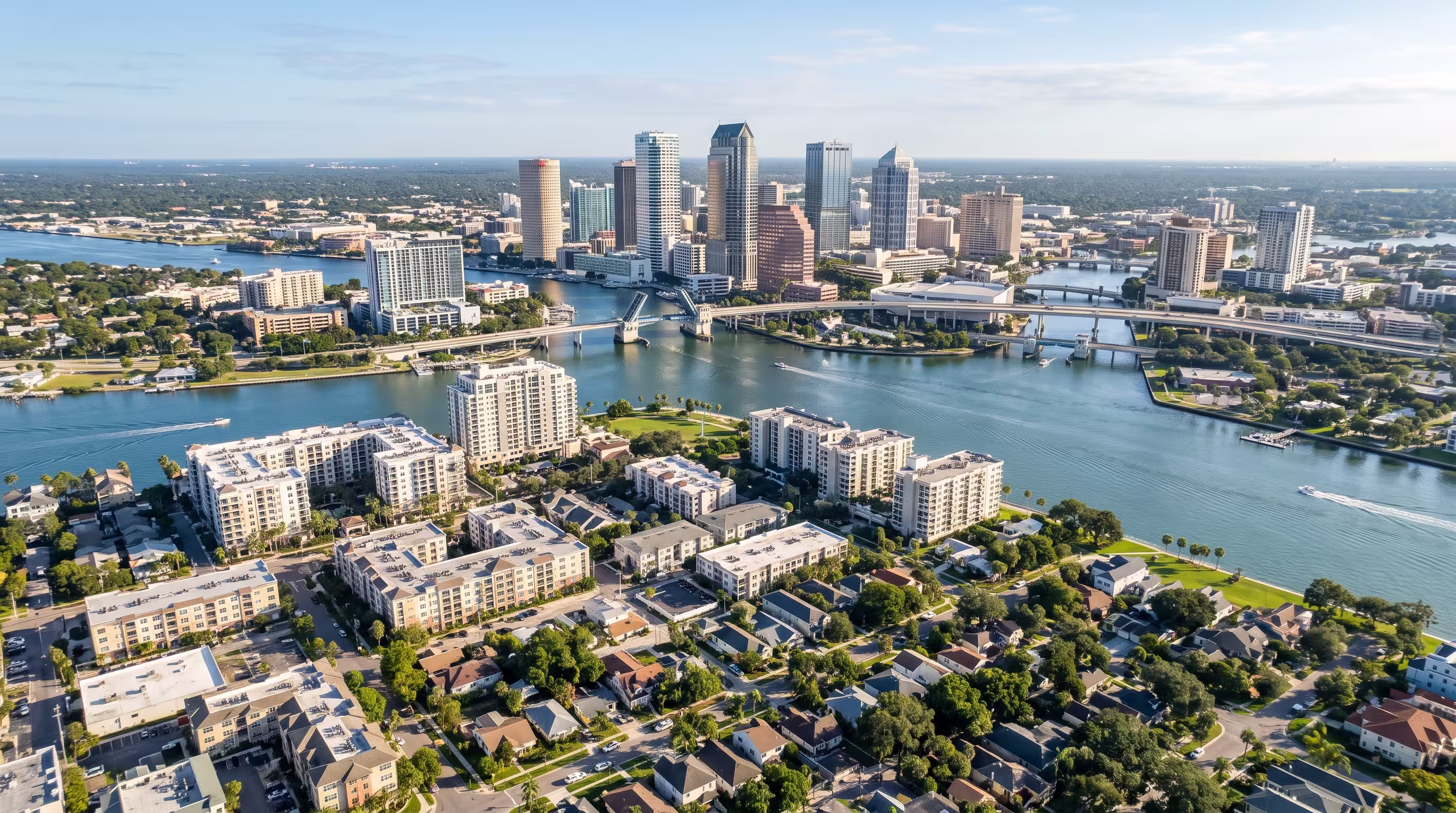 Aerial view of the Tampa skyline, waterfront, and surrounding neighborhoods in Florida.