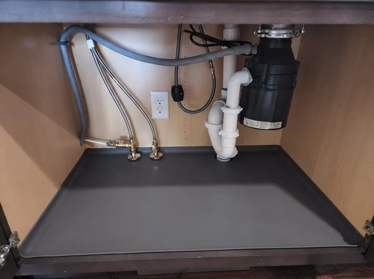 Completed kitchen sink plumbing and fixture connections