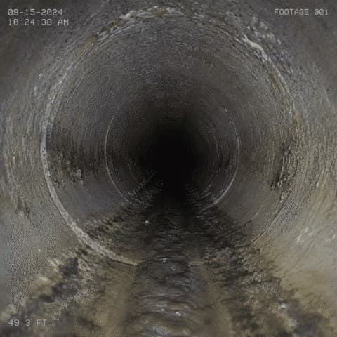 Still frame from a sewer video camera inside a residential sewer pipe