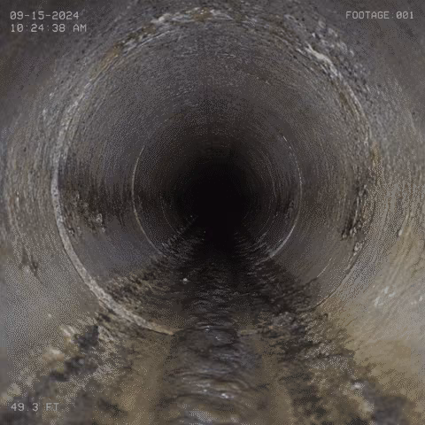 Still frame from a sewer video camera inside a residential sewer pipe